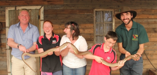 The Taylor family on a recent trip to Australia (Lachlan likes snakes but Thomas obviously doesn't!)